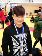 Hymykin irtosi mitali kaulassa, vaikka hieman tappio rassasi. Kaveri oli vain tällä kertaa liian hyvä.